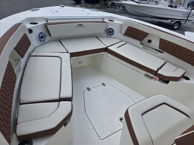 Slide: The Image of Cobia 245CC 2027: Spacious bow area with cushioned seating and speakers. - 21