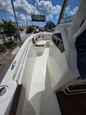 Slide: The Image of Cobia 245CC 2027: Spacious deck with modern features and clear view. - 19