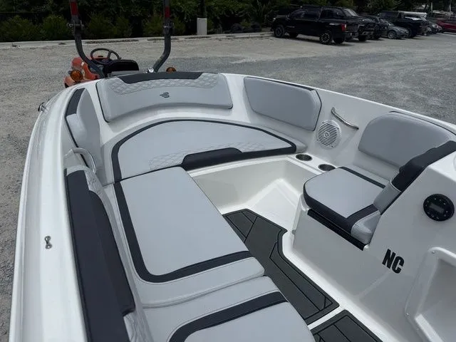 Slide: The Image of The image shows the cockpit of a 2025 Bayliner M15 with gray and white upholstery. - 4