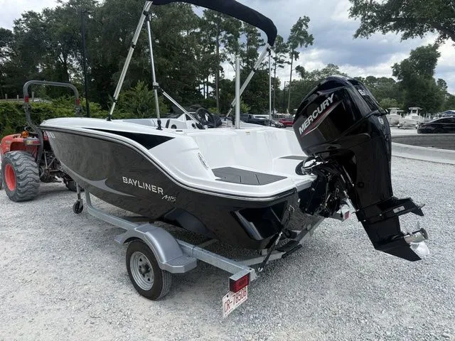 Slide: The Image of A 2025 Bayliner M15 boat on a trailer. It features a Mercury outboard motor. - 3