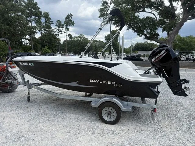 Slide: The Image of A 2025 Bayliner M15 on a trailer. It features a Mercury outboard motor. - 2