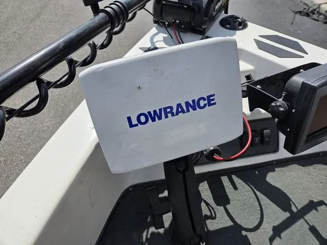Slide: The Image of A Lowrance fish finder is mounted on a 2003 Stratos 21 MSX boat. - 24