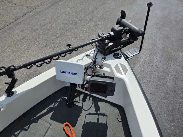 Slide: The Image of The image shows the bow deck of a Stratos 21 MSX boat with a Minn Kota motor. - 23
