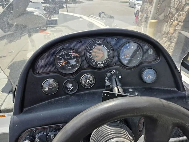 Slide: The Image of The dashboard of a 2003 Stratos 21 MSX with various gauges and a steering wheel. - 20