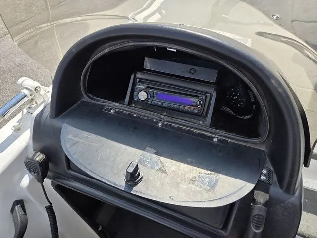 Slide: The Image of The image shows the dashboard of a 2003 Stratos 21 MSX boat with a built-in radio. - 16