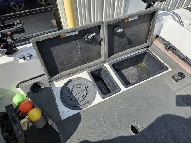 Slide: The Image of The image shows the cockpit of a 2003 Stratos 21 MSX with storage compartments and cup holders. - 11