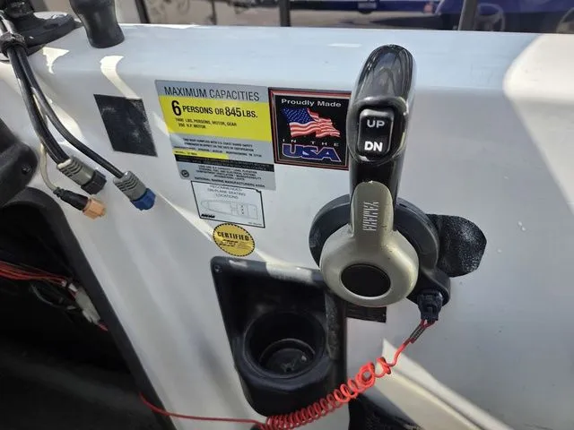 Slide: The Image of Close-up of a boat control system with a lever and a USA sticker. - 21