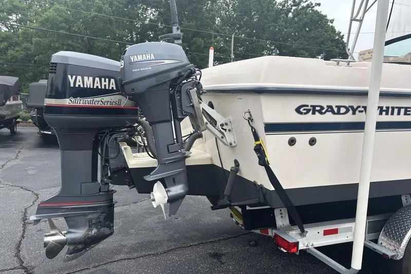 Slide: The Image of 1999 Grady-White Gulfstream 232 boat with Yamaha outboard engines on a trailer. - 31