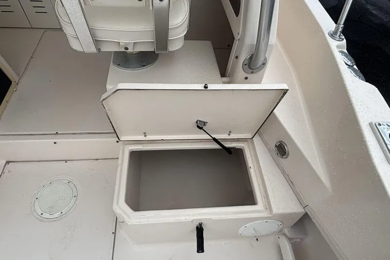 Slide: The Image of Open storage compartment on a 1999 Grady-White Gulfstream 232 boat deck. - 21