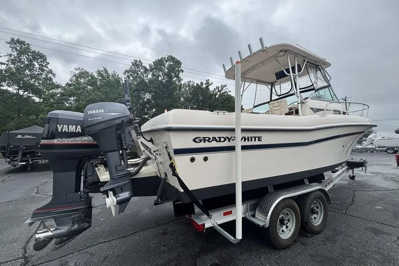 Slide: The Image of 1999 Grady-White Gulfstream 232 boat on trailer with Yamaha outboard engines. - 5