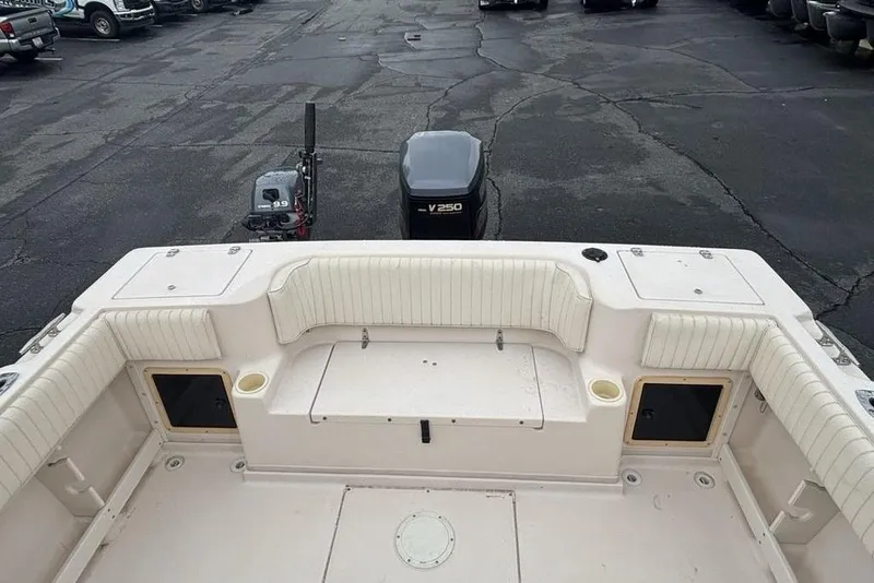 Slide: The Image of 1999 Grady-White Gulfstream 232 boat interior with seating and outboard motor. - 2
