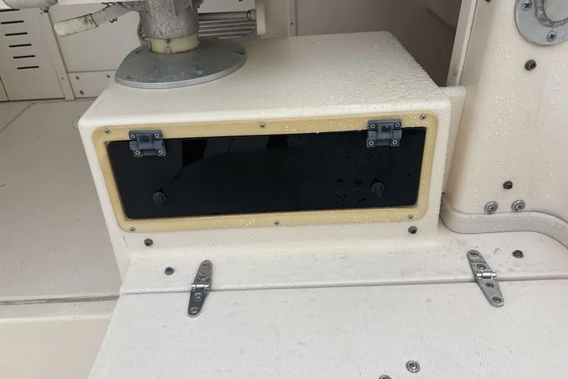 Slide: The Image of Grady-White Gulfstream 232 boat interior detail, featuring a storage compartment, 1999 model. - 22