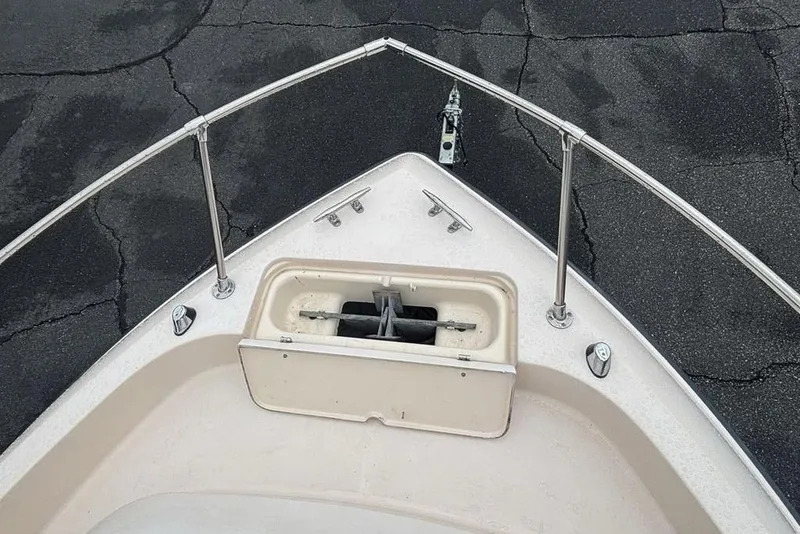 Slide: The Image of Bow of a 1999 Grady-White Gulfstream 232 boat with anchor storage. - 23
