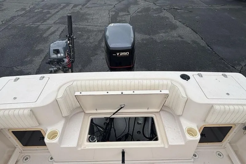 Slide: The Image of 1999 Grady-White Gulfstream 232 boat deck with Yamaha V250 and 9.9 engines. - 9
