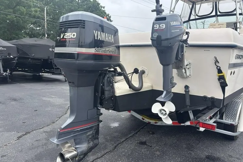 Slide: The Image of 1999 Grady-White Gulfstream 232 boat with Yamaha outboard motors, parked on a trailer. - 35
