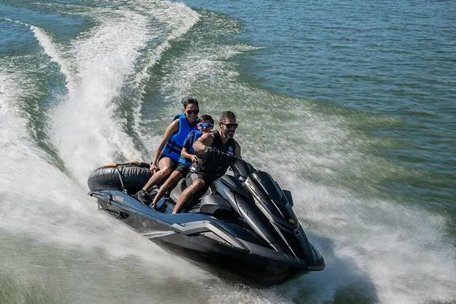 Slide: The Image of Three people ride a Yamaha WaveRunner FX Limited SVHO across the water. - 5