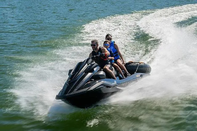 Slide: The Image of Three people ride a Yamaha WaveRunner FX Limited SVHO across the water. - 6