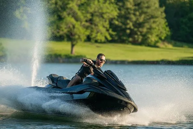 Slide: The Image of A man rides a Yamaha WaveRunner FX Limited SVHO on a lake, splashing water around. - 7