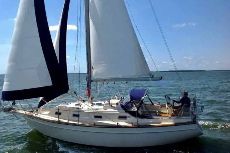 The Image of Sailing on a 1998 Island Packet 320 yacht with full sails on open water. - 0