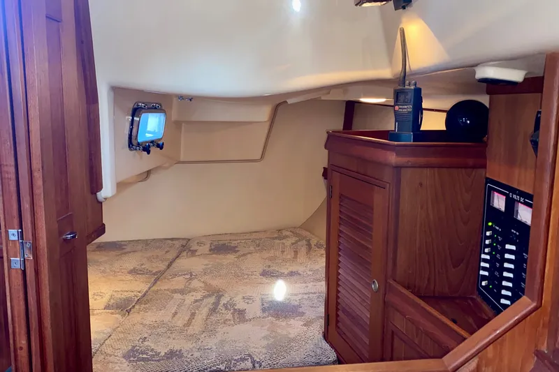 Slide: The Image of Aft Cabin with athwartship double bunk, Locker and electrical panels. - 20