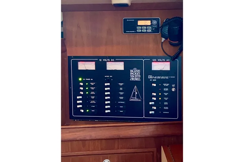 Slide: The Image of Electrical 120/12v circuit breaker panel, Volt & Amp meters, and VHF. - 23