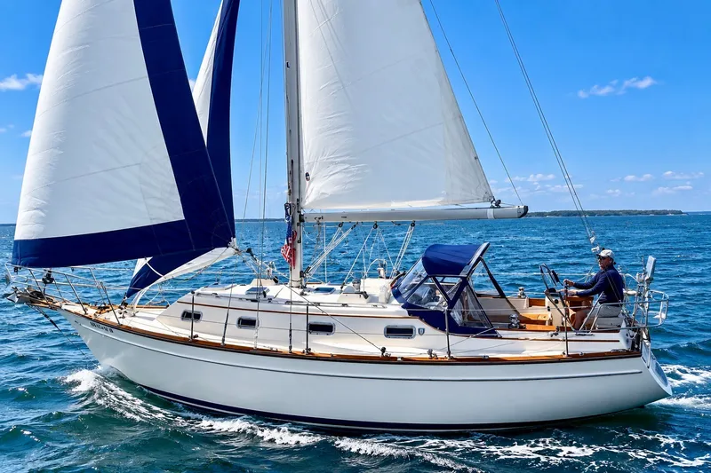 The Image of Sailing on a 1998 Island Packet 320 yacht in clear blue waters. - 1