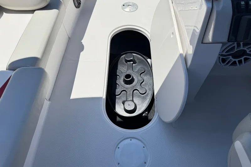 Slide: The Image of 2021 Starcraft MDX 211 O/B boat interior with open storage compartment. - 27