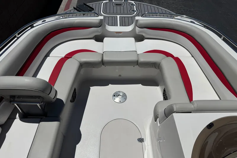 Slide: The Image of 2021 Starcraft MDX 211 O/B boat interior with red and gray seating. - 12
