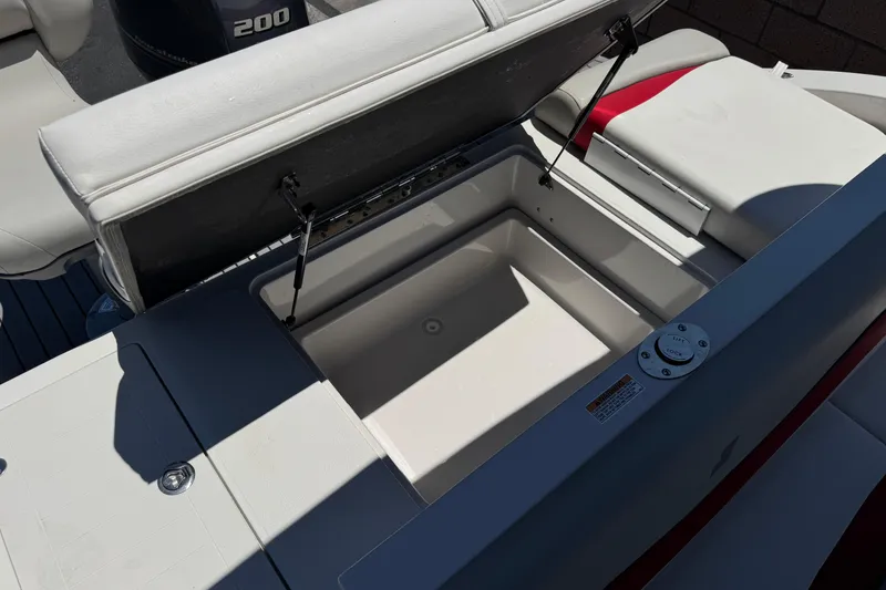 Slide: The Image of Open storage compartment on a 2021 Starcraft MDX 211 O/B boat. - 25