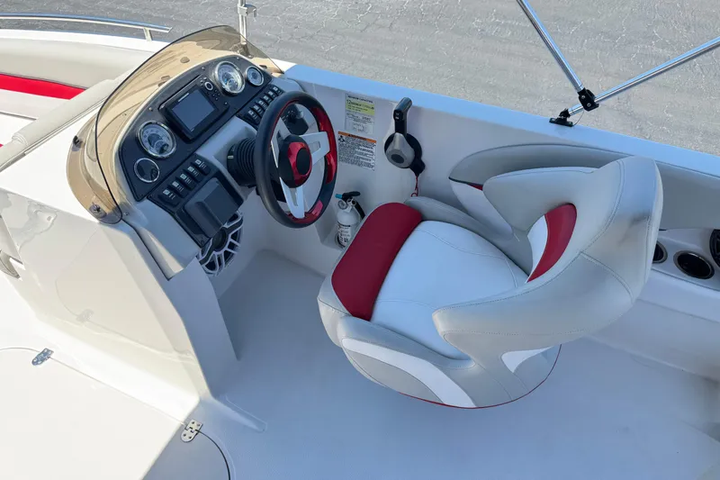 Slide: The Image of Cockpit of 2021 Starcraft MDX 211 O/B boat with modern steering and controls. - 28