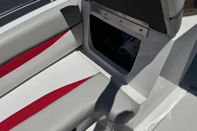 Slide: The Image of Interior seating of 2021 Starcraft MDX 211 O/B boat with red and gray accents. - 17