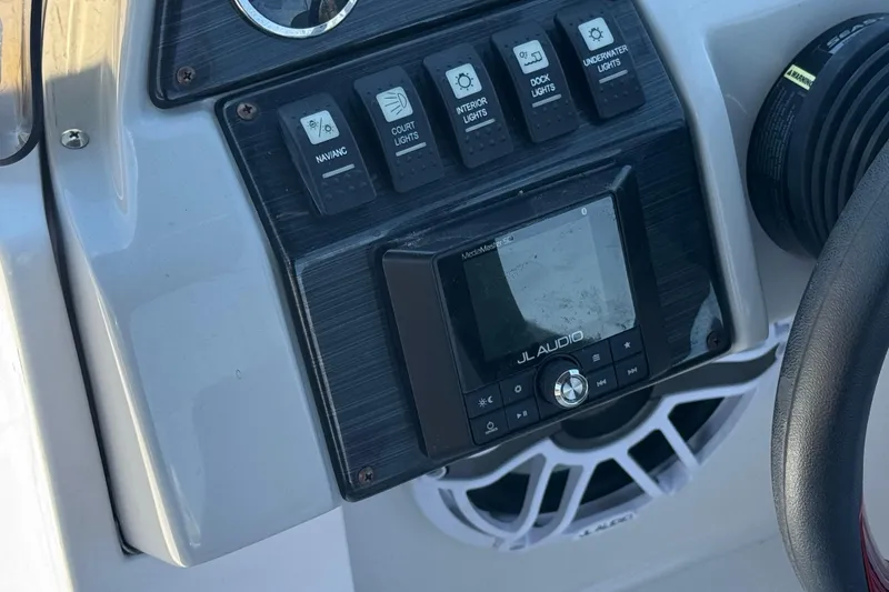 Slide: The Image of Control panel of 2021 Starcraft MDX 211 O/B boat with JL Audio system. - 30