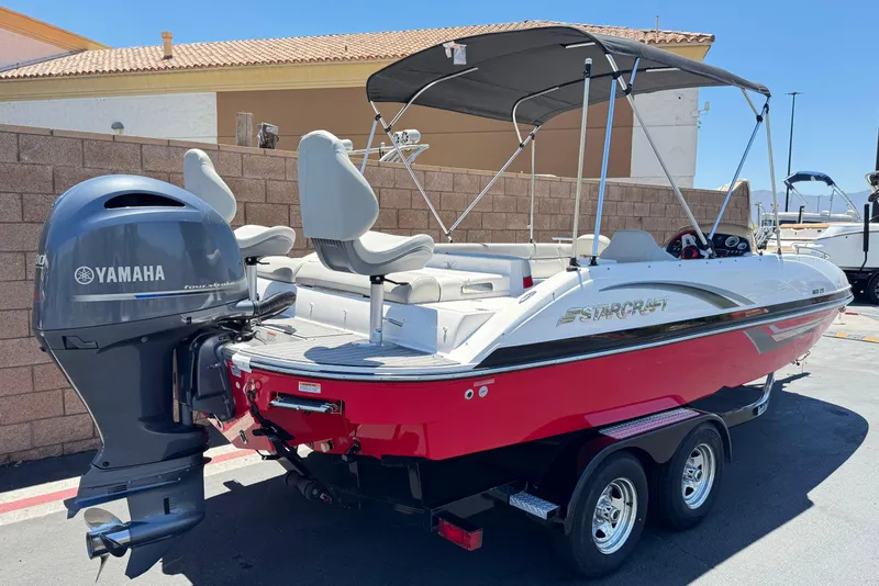 Slide: The Image of 2021 Starcraft MDX 211 O/B boat with Yamaha outboard motor, red and white design. - 5