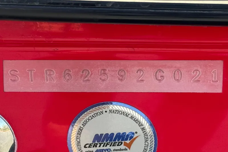 Slide: The Image of 2021 Starcraft MDX 211 O/B boat with visible hull identification number and NMMA certification. - 36