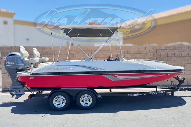 The Image of 2021 Starcraft MDX 211 O/B boat with Yamaha engine on trailer, red and white design. - 0