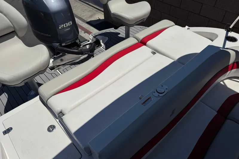 Slide: The Image of 2021 Starcraft MDX 211 O/B boat interior with Yamaha 200 engine, featuring red and white seating. - 24