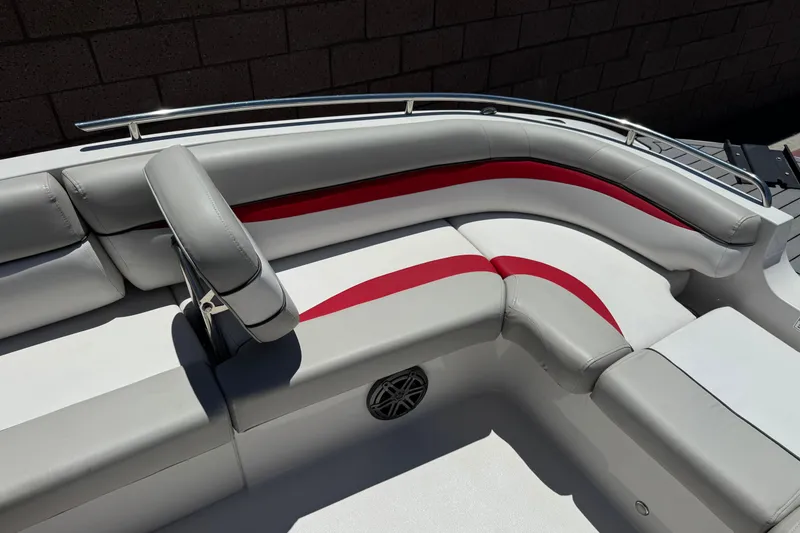 Slide: The Image of 2021 Starcraft MDX 211 O/B boat interior with gray and red seating. - 13