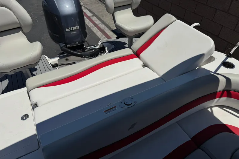 Slide: The Image of 2021 Starcraft MDX 211 O/B boat interior with Yamaha 200 engine, featuring white and red seating. - 26