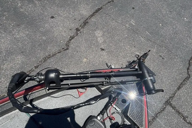 Slide: The Image of Boat motor on a 1996 Javelin 369 SDC, parked on asphalt. - 11