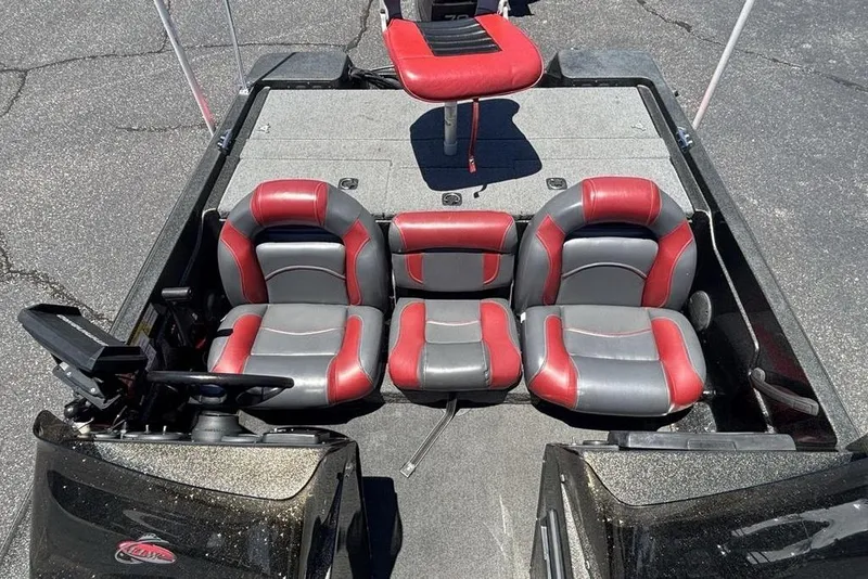 Slide: The Image of Interior of a 1996 Javelin 369 SDC boat with red and gray seating. - 12