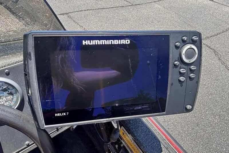 Slide: The Image of Humminbird Helix 7 fish finder on a 1996 Javelin 369 SDC boat dashboard. - 16
