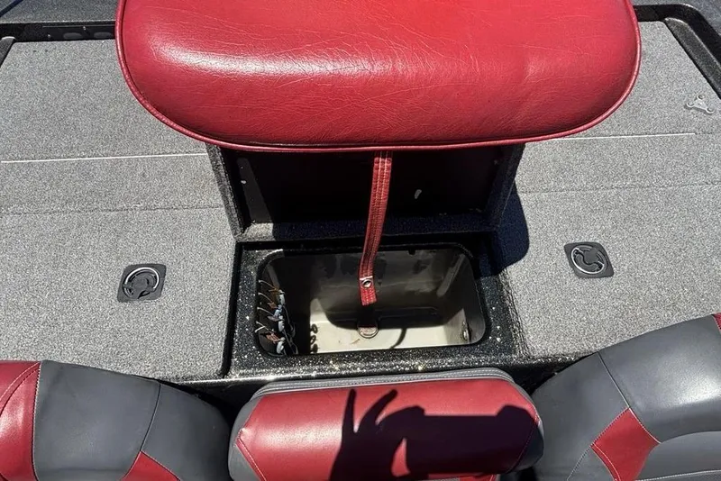 Slide: The Image of Red and gray interior of a 1996 Javelin 369 SDC boat with storage compartment. - 18