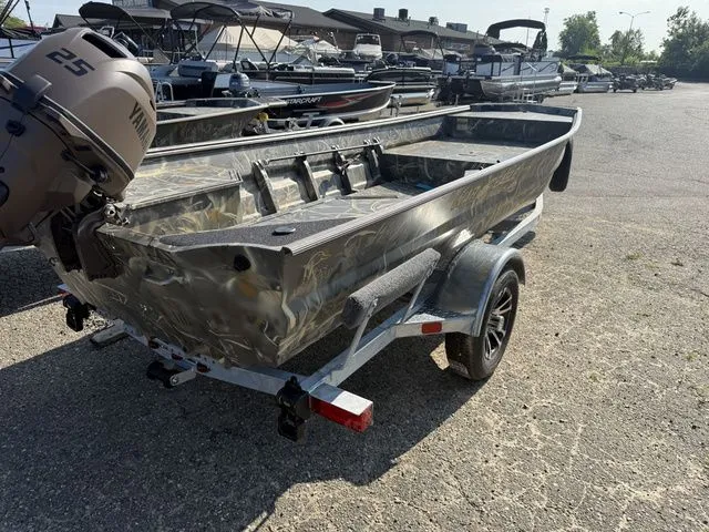 Slide: The Image of A 2026 War Eagle 648LDV boat on a trailer in a sunny outdoor area. - 3