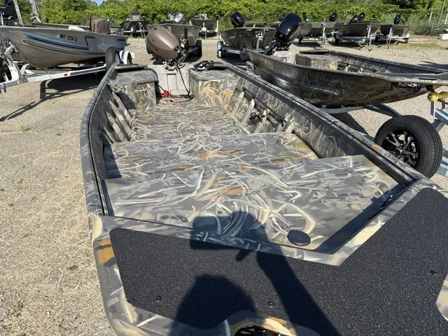 Slide: The Image of The image shows a 2026 War Eagle 648LDV boat with camouflage pattern and open interior. - 4