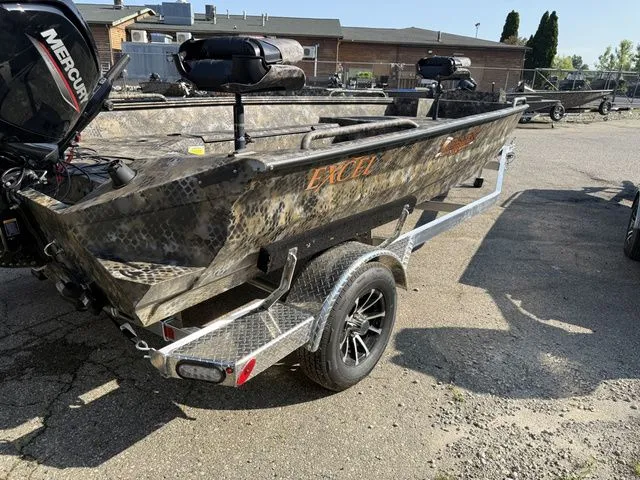 Slide: The Image of An Excel Tomahawk 183 T boat from 2026 on a trailer, equipped with a Mercury engine. - 3