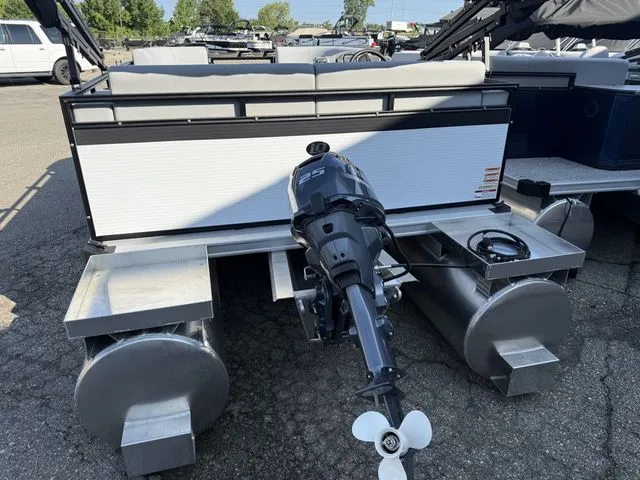 Slide: The Image of Angler Quest 7515 Leisure Cruise 2026 with outboard motor and aluminum pontoons in a parking lot. - 9