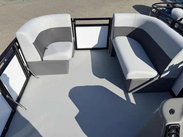 Slide: The Image of The image shows the deck of a 2026 Angler Quest 7515 Leisure Cruise boat with gray and white seating. - 6