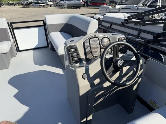 Slide: The Image of The image shows the cockpit of a 2026 Angler Quest 7515 Leisure Cruise with a modern helm. - 7