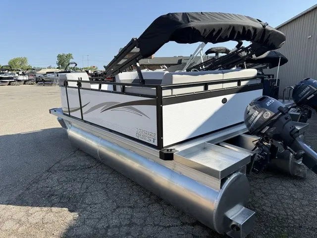 Slide: The Image of A 2026 Angler Quest 7515 Leisure Cruise pontoon boat with a black canopy and outboard motors. - 3