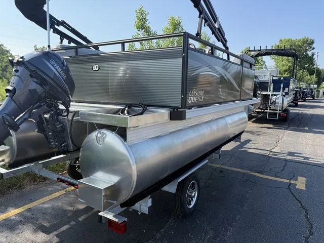 Slide: The Image of A 2026 Angler Quest 7515 Leisure Cruise pontoon boat on a trailer, featuring an outboard motor. - 3